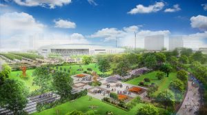 A vibrant community park with green spaces, pathways, and modern buildings under a blue sky.