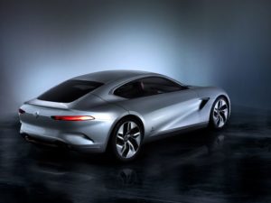 Sleek silver futuristic concept car with aerodynamic design and glowing accents.