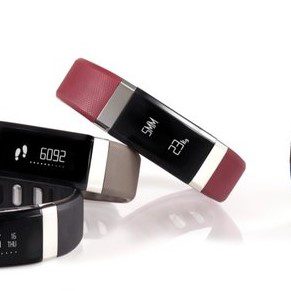 A collection of colorful fitness trackers with digital displays.