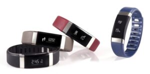 A collection of fitness trackers with digital displays in various colors.