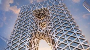 Intricate lattice structure framing a clear sky at sunset.