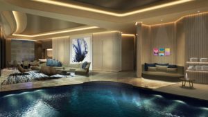 Luxurious indoor pool area with modern seating and elegant lighting.