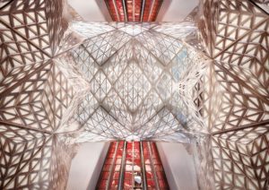Intricate geometric metal structure inside a modern building.