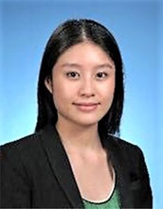 Professional headshot of a woman with black hair in business attire.
