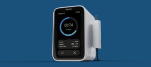Compact medical device with a digital screen and attached probe.
