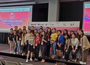 Group photo of diverse women at a conference event.