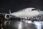 Air France airplane parked at night on wet tarmac under dark sky.