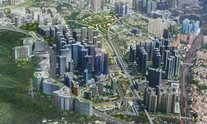 Aerial view of a modern cityscape with tall buildings and green spaces.